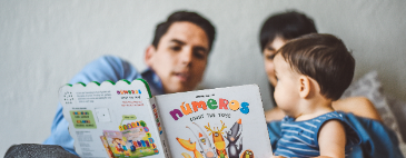 Image of family reading together